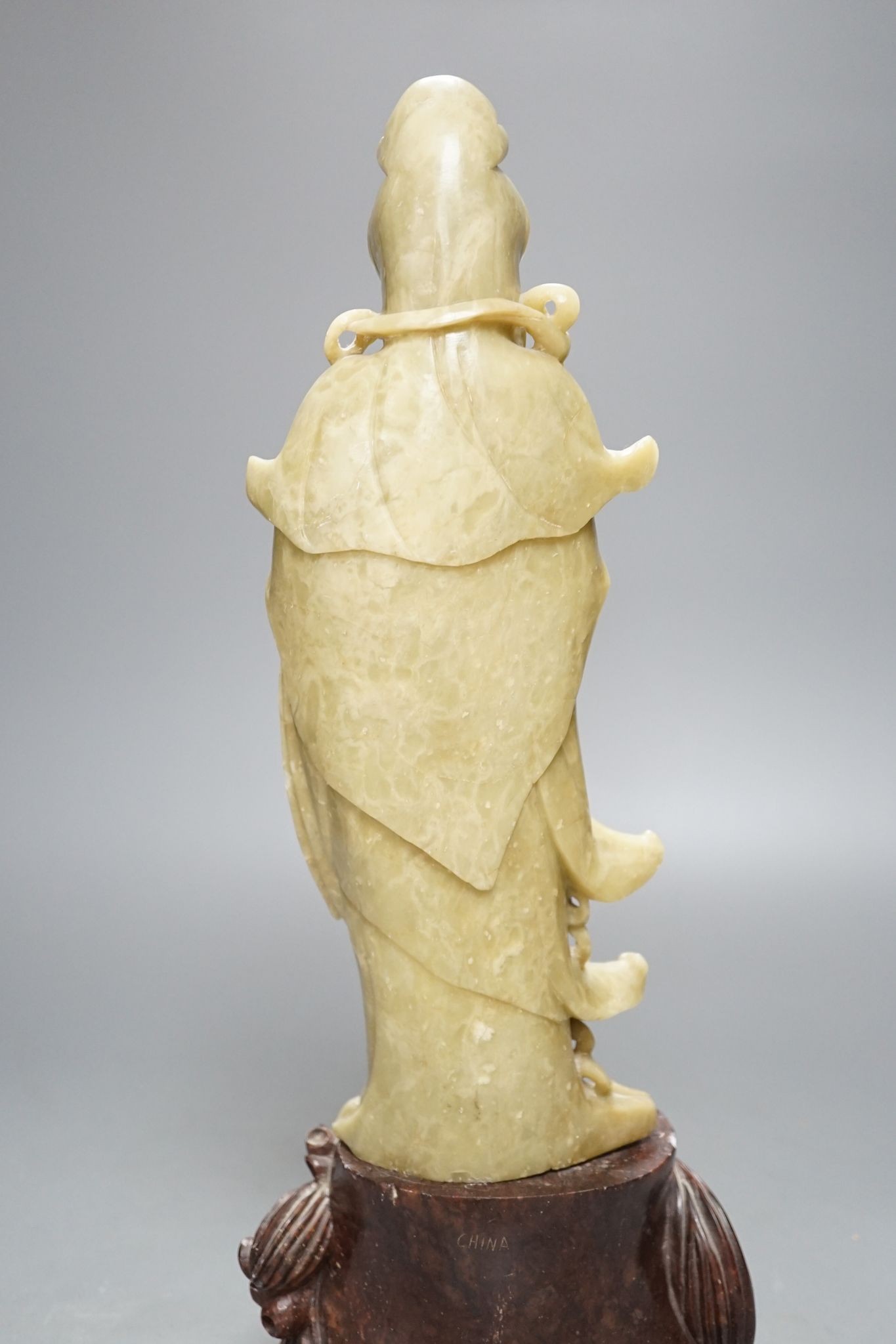 A large Chinese soapstone figure of Guanyin, on base, 40cm